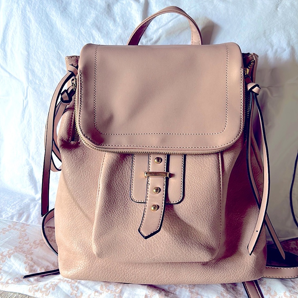 Blush/ pink faux leather backpack with multiple pockets , for traveling,camping